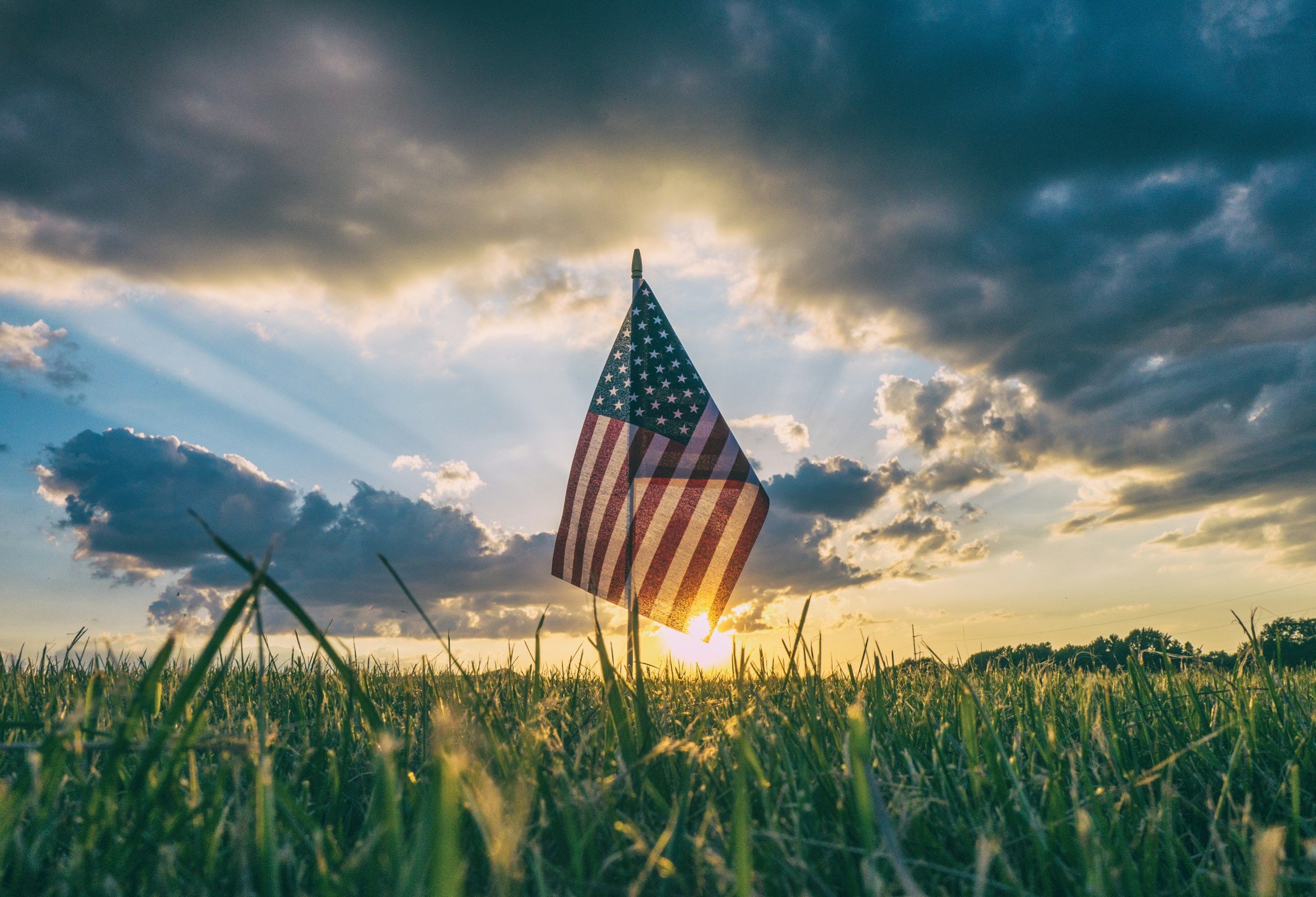 American flag in field representing our support for veterans and first responders